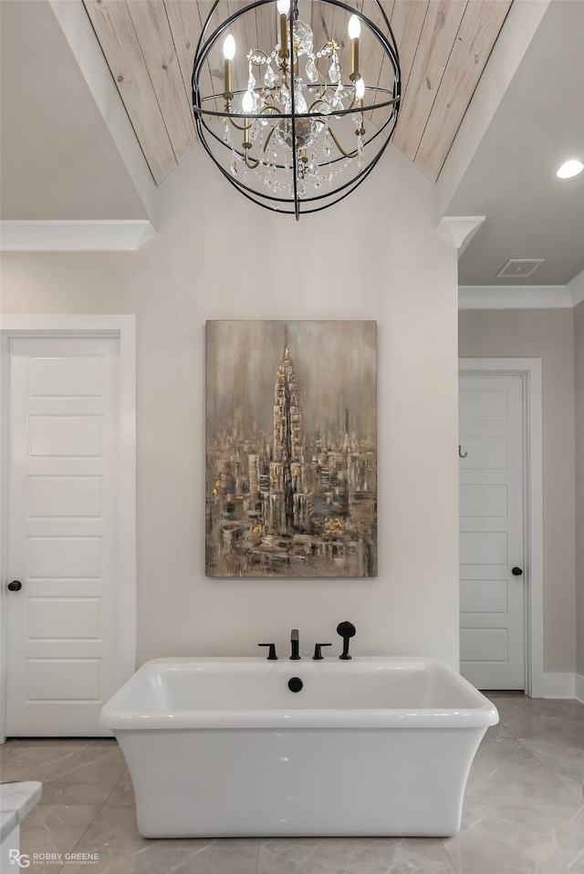 642 Caledonia Dr, Bossier City, LA 71111 - bathroom with a chandelier, marble finish floor, a freestanding tub, ornamental molding, and visible vents