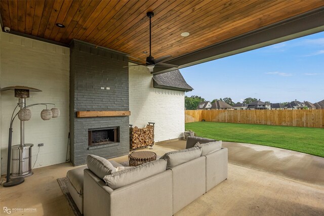 642 Caledonia Dr, Bossier City, LA 71111 - view of patio / terrace featuring an outdoor living space with a fireplace, ceiling fan, and fence