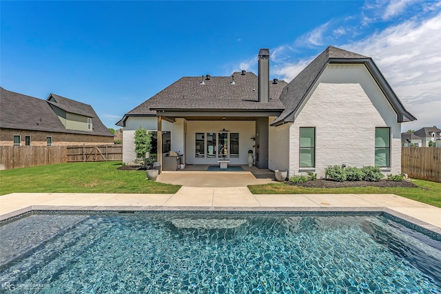 642 Caledonia Dr, Bossier City, LA 71111 - back of house with a fenced backyard, a fenced in pool, a patio area, a ceiling fan, and a lawn