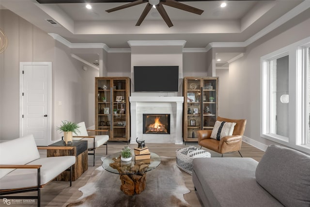 642 Caledonia Dr, Bossier City, LA 71111 - living area featuring ceiling fan, visible vents, baseboards, a fireplace, and wood finished floors