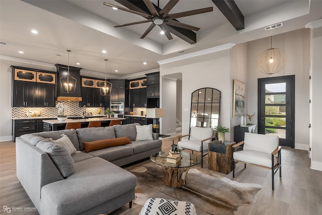 642 Caledonia Dr, Bossier City, LA 71111 - living room featuring ornamental molding, a ceiling fan, visible vents, and light wood-style flooring