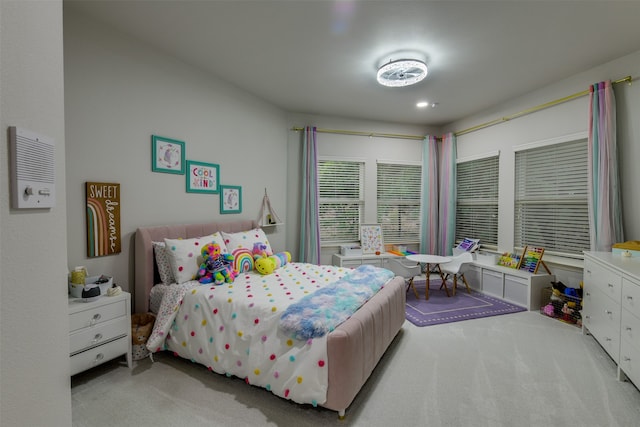 bedroom featuring light colored carpet