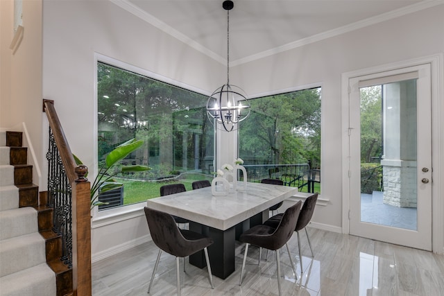 dining area featuring a notable chandelier, light wood-type flooring, and ornamental molding