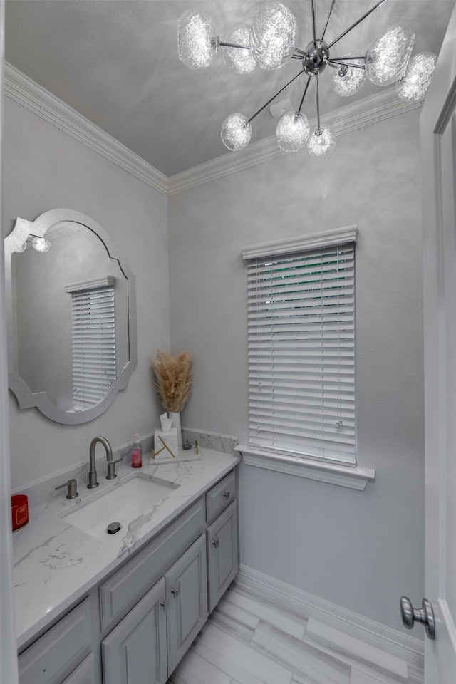 bathroom featuring crown molding and vanity