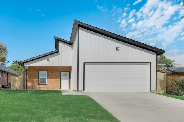 view of front facade with a front yard and a garage