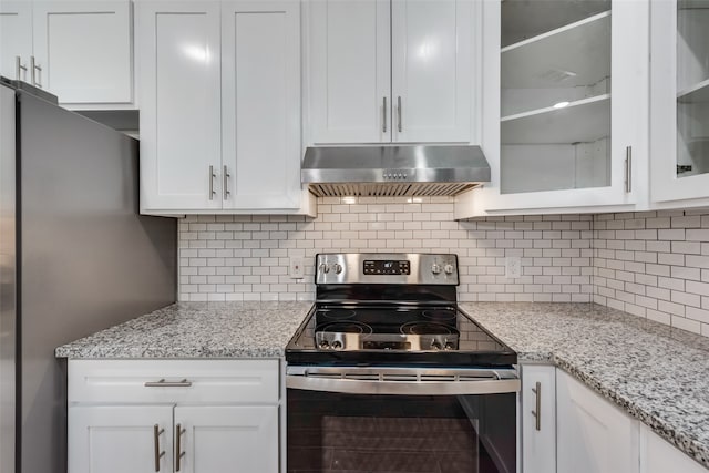 kitchen featuring white cabinets, backsplash, stainless steel appliances, and range hood