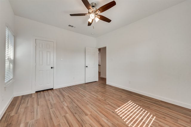 unfurnished bedroom featuring light hardwood / wood-style flooring and ceiling fan