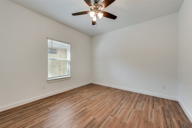 empty room featuring ceiling fan and light wood-type flooring