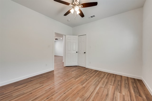 unfurnished room featuring light wood-type flooring and ceiling fan