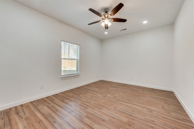 unfurnished room featuring ceiling fan and light hardwood / wood-style flooring