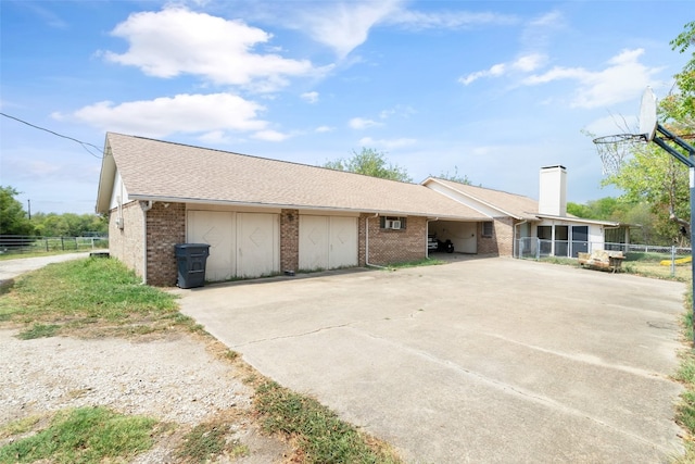 ranch-style house featuring a carport