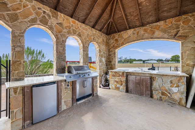 view of patio / terrace featuring an outdoor kitchen and grilling area