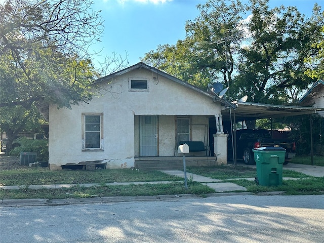 view of front of home with a carport