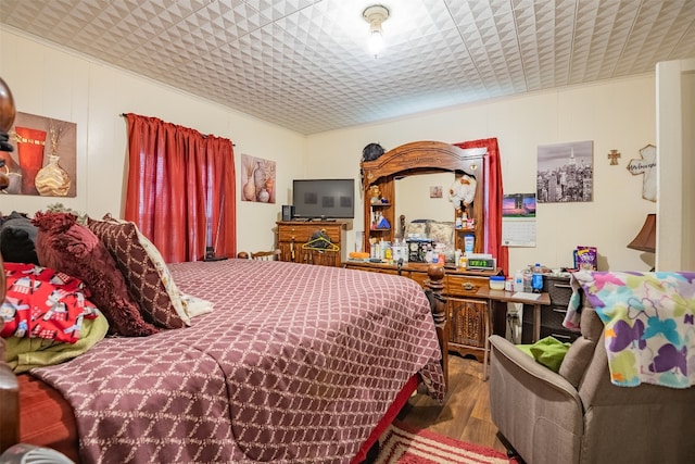 bedroom featuring dark wood-type flooring