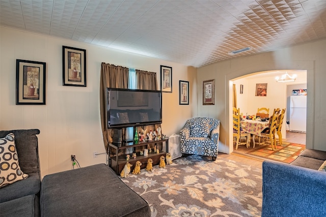 living room with a notable chandelier