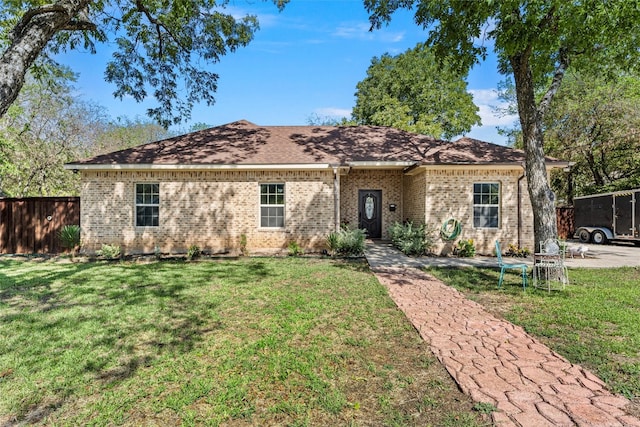 ranch-style house with a front lawn