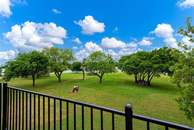 view of yard with a balcony