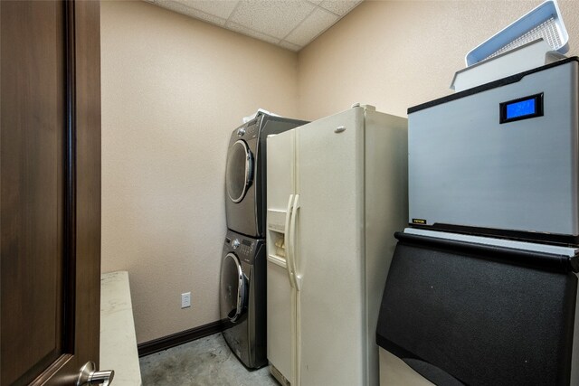 laundry room with stacked washer and clothes dryer