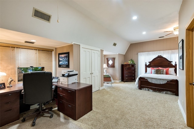 office space with light carpet, lofted ceiling, ceiling fan, and a healthy amount of sunlight