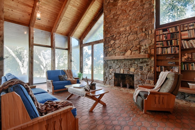 living room with plenty of natural light, beamed ceiling, and wooden ceiling