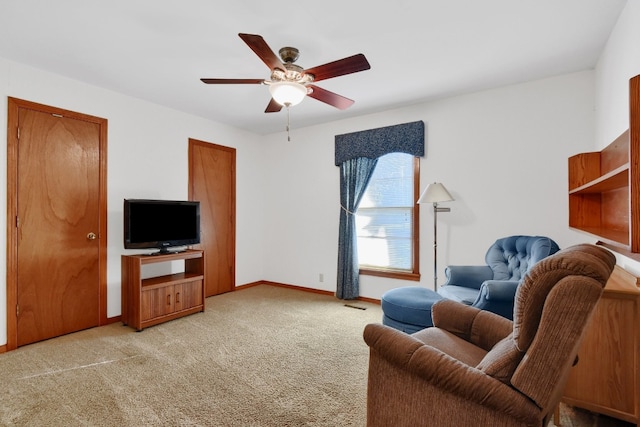 living room with ceiling fan and light carpet