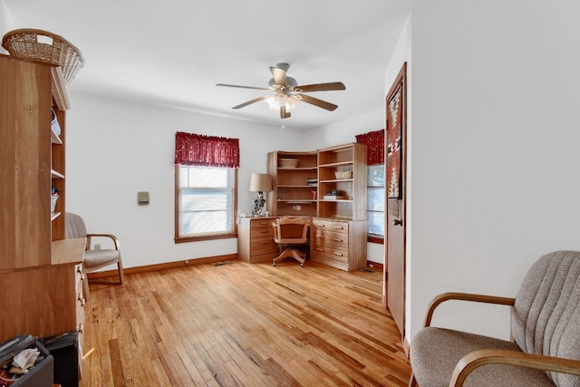 office area featuring light hardwood / wood-style flooring and ceiling fan