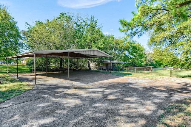 view of vehicle parking featuring a carport