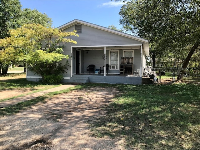 back of property featuring covered porch