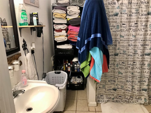 bathroom with tile floors and sink