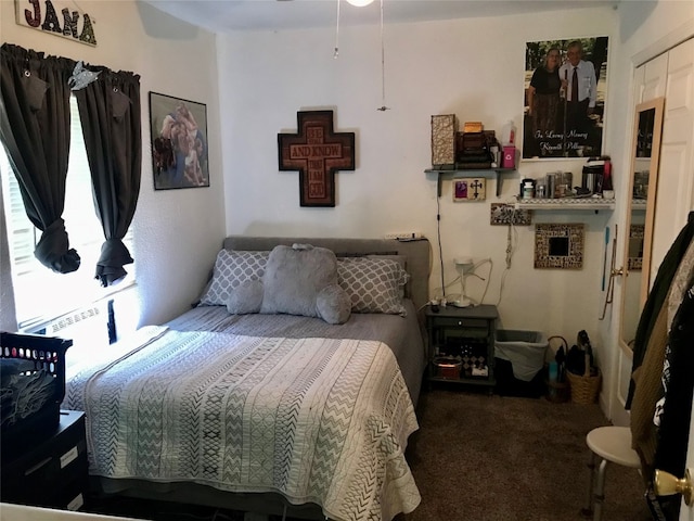 carpeted bedroom featuring a closet