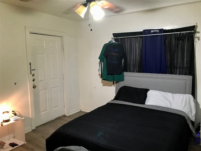 bedroom featuring ceiling fan and hardwood / wood-style flooring