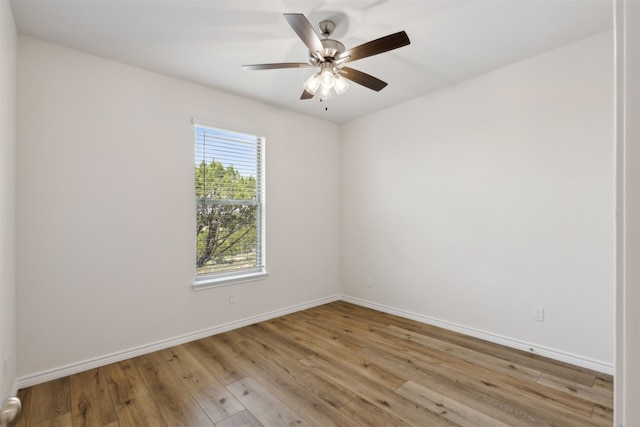 spare room with light hardwood / wood-style flooring and ceiling fan