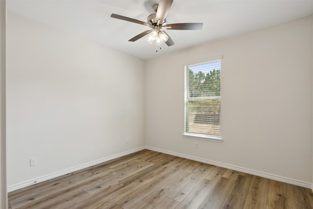 spare room featuring light hardwood / wood-style floors and ceiling fan