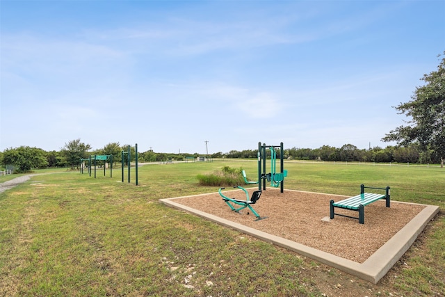 view of jungle gym featuring a lawn