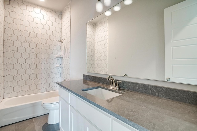 full bathroom featuring tile patterned floors, vanity, toilet, and tiled shower / bath