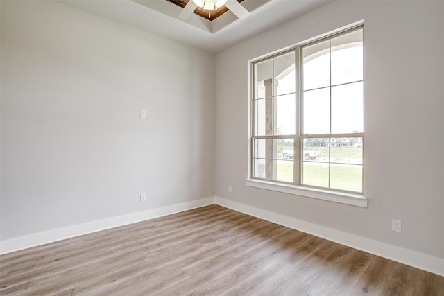 spare room featuring light hardwood / wood-style floors and ceiling fan