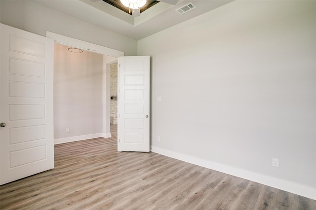 spare room featuring light hardwood / wood-style floors