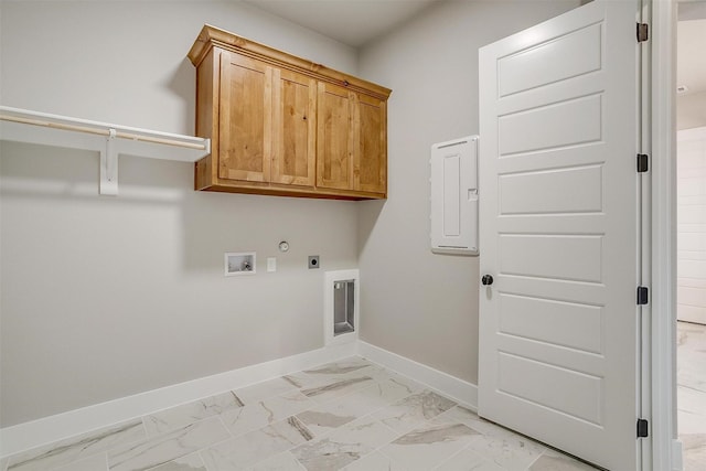 washroom with cabinets, washer hookup, hookup for an electric dryer, hookup for a gas dryer, and electric panel