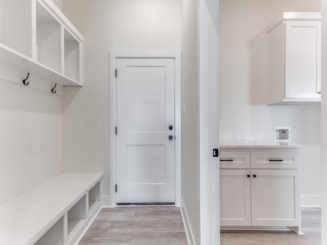 mudroom with light hardwood / wood-style flooring