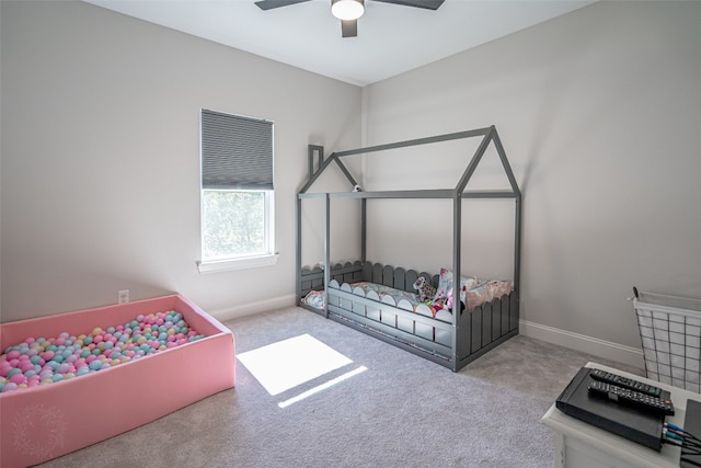 bedroom with ceiling fan and light carpet