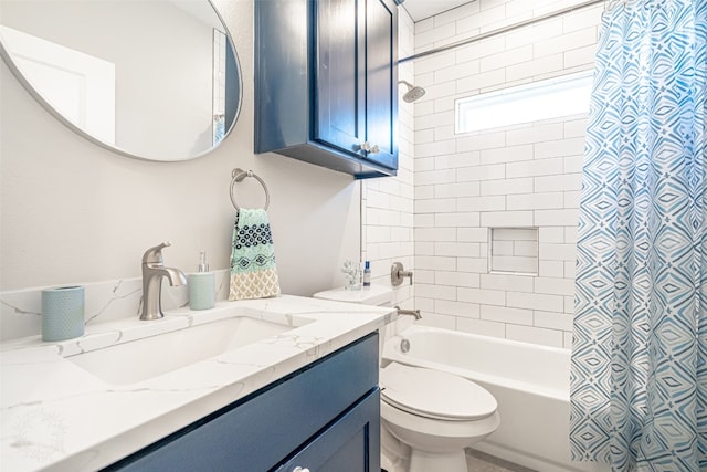 full bathroom with shower / bath combo with shower curtain, vanity, and toilet