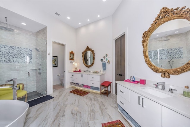 bathroom featuring vanity, shower with separate bathtub, and tile floors