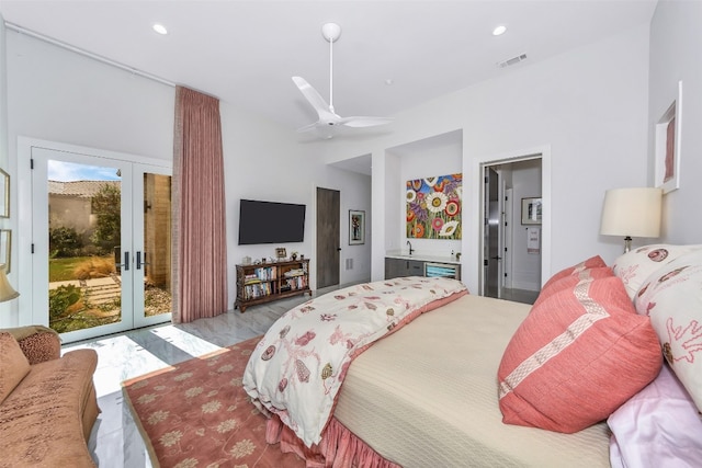 bedroom with multiple windows, ceiling fan, access to outside, and french doors