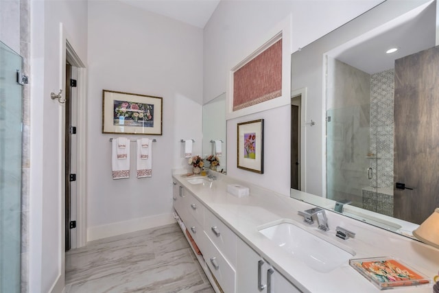 bathroom with tile floors, double sink, a shower with shower door, and oversized vanity