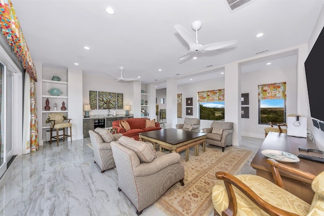 living room with light tile floors, beverage cooler, ceiling fan, and built in features