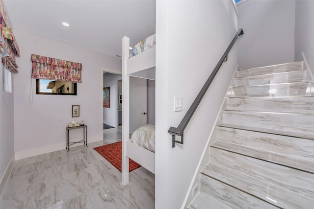 stairs featuring light tile floors