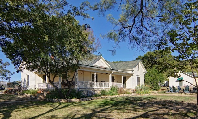 view of front of home with a front lawn and a porch