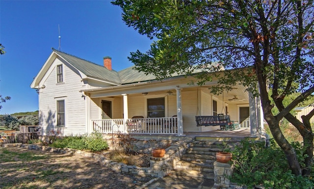 view of front of property featuring covered porch