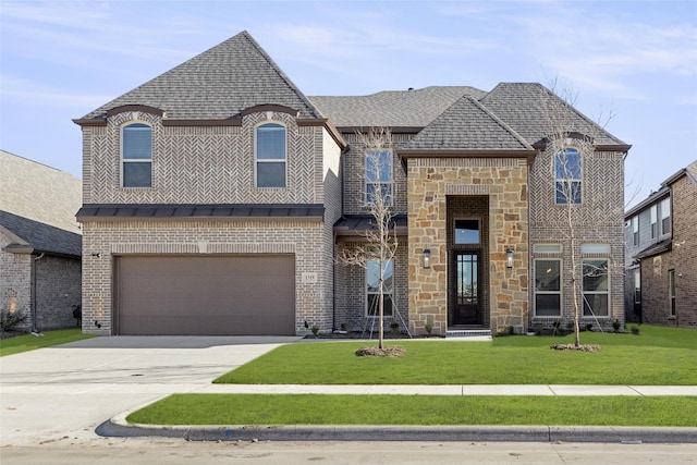 french country style house featuring a front lawn and a garage