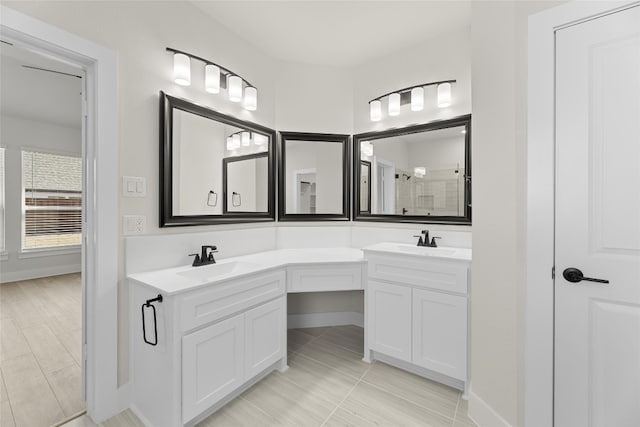 bathroom with tile floors and dual bowl vanity